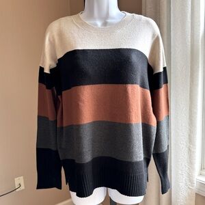 Ivory, black, caramel and charcoal striped sweater. Size Medium